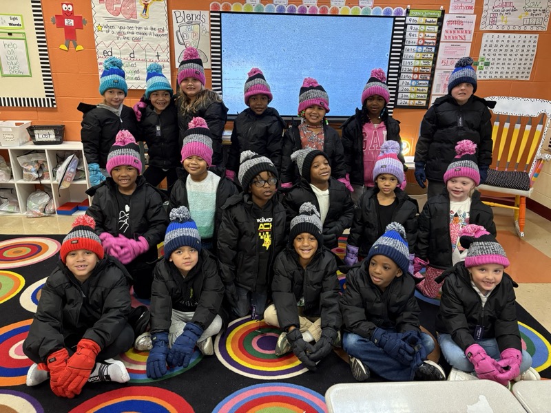 Kids at Harter Elementary with new coats from Multipliers community impact